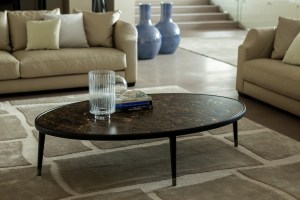 Bigne oval coffee table with dark marble top.